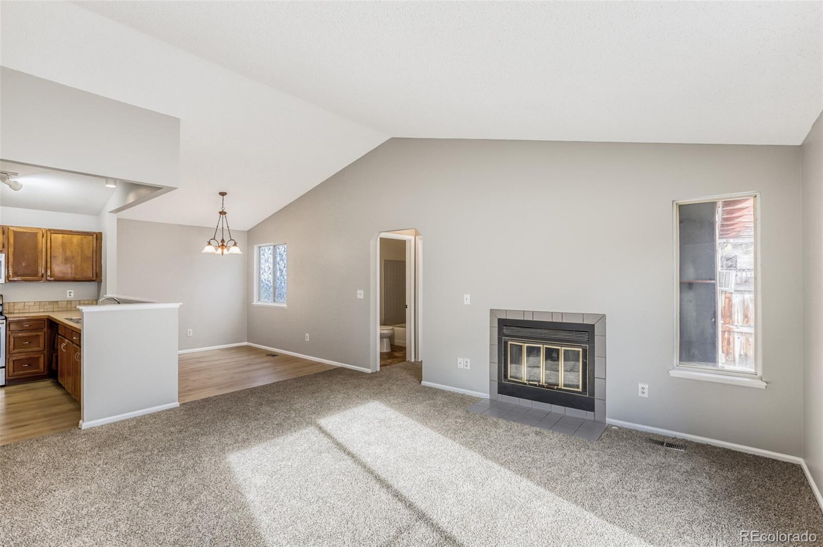 1912 Rice Street Longmont, CO 80501 - Photo 6 of 29 a view of livingroom with a flat screen tv