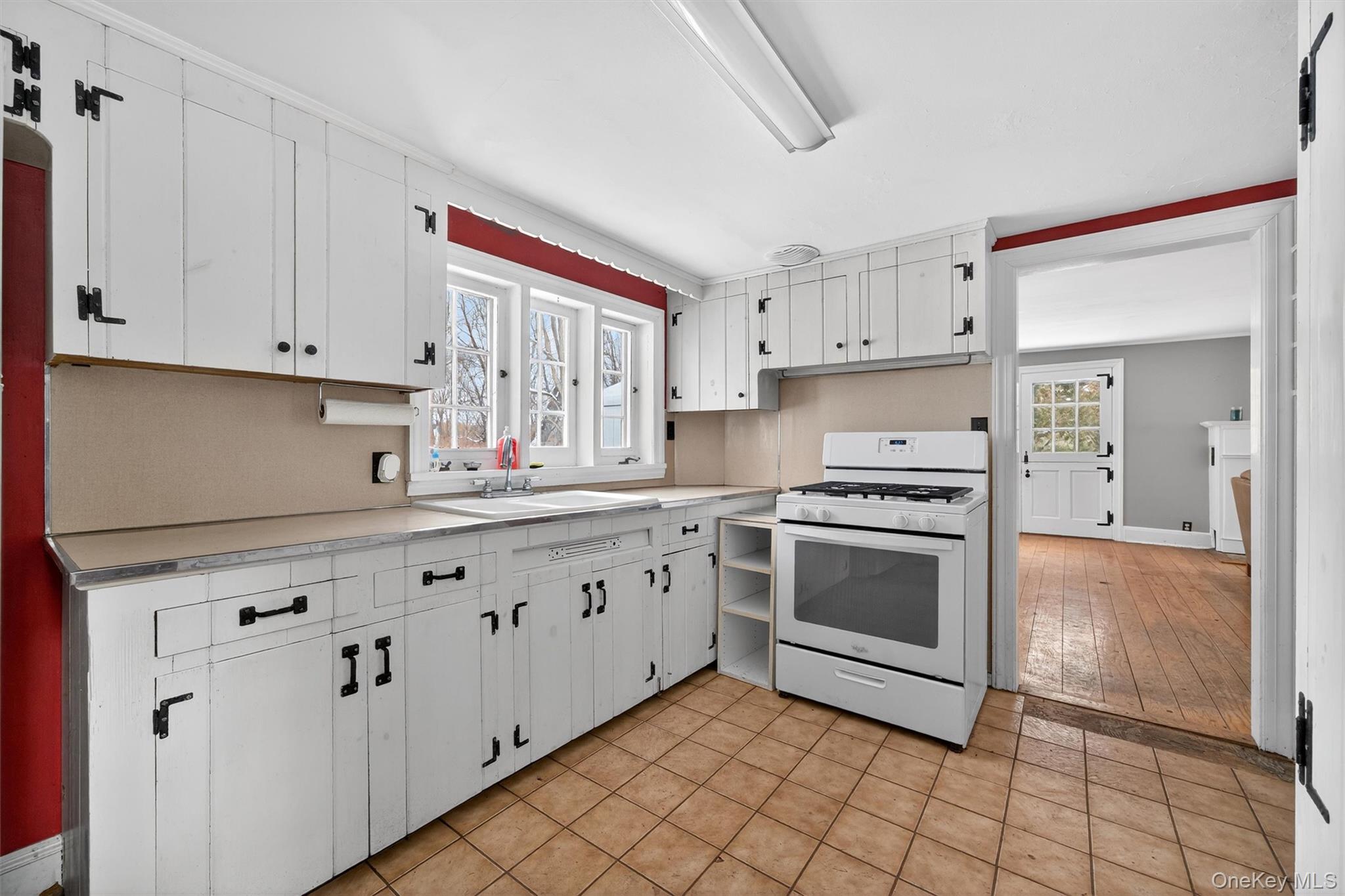 74 Onderdonk Road Warwick, NY 10990 - Photo 19 of 38 a kitchen with granite countertop white cabinets and white appliances