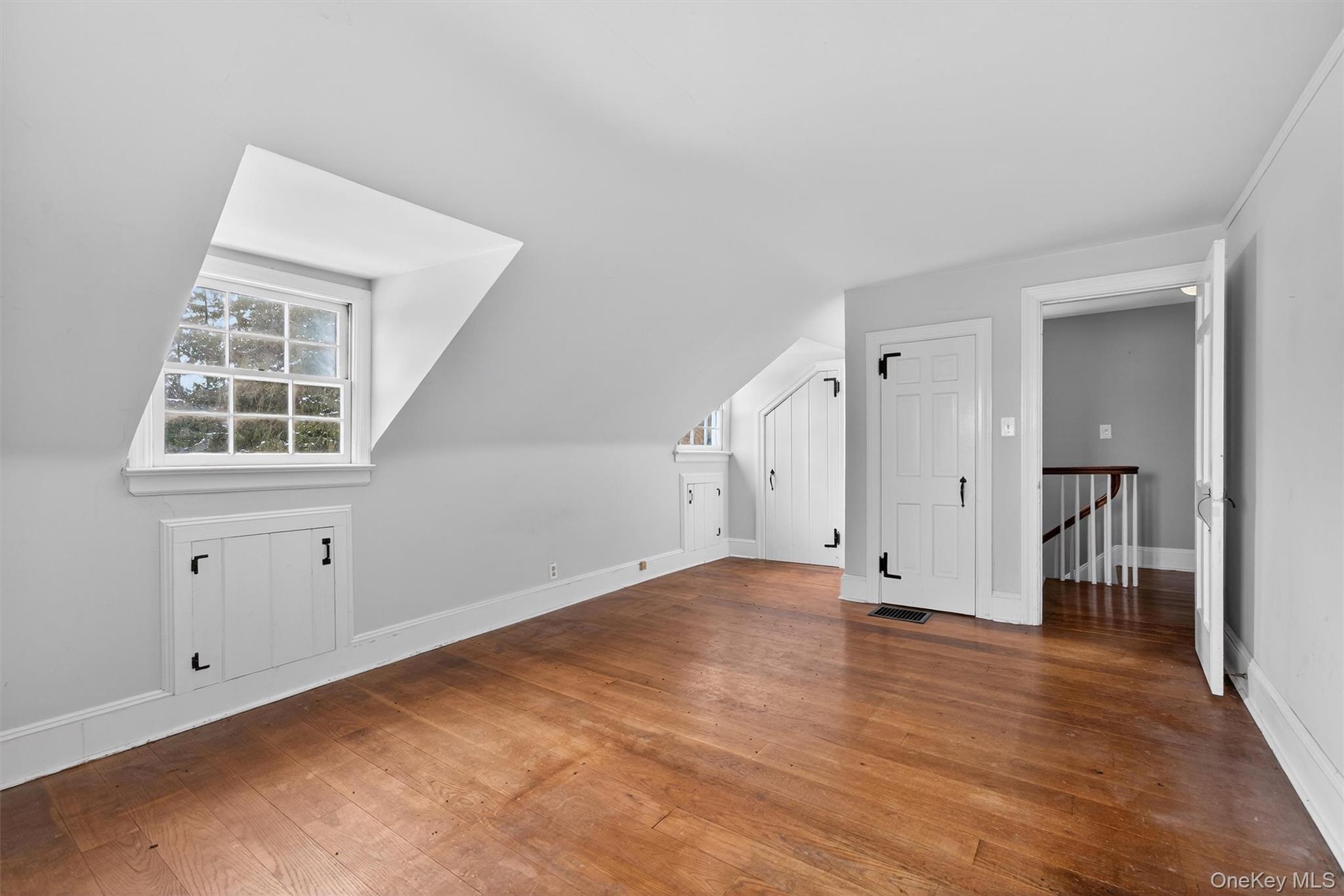 74 Onderdonk Road Warwick, NY 10990 - Photo 21 of 38 an empty room with wooden floor and windows