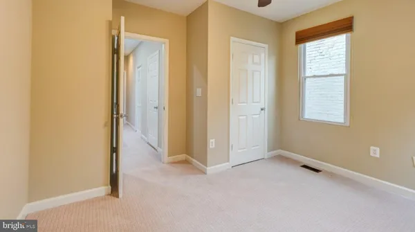 a view of a room that has a window in it