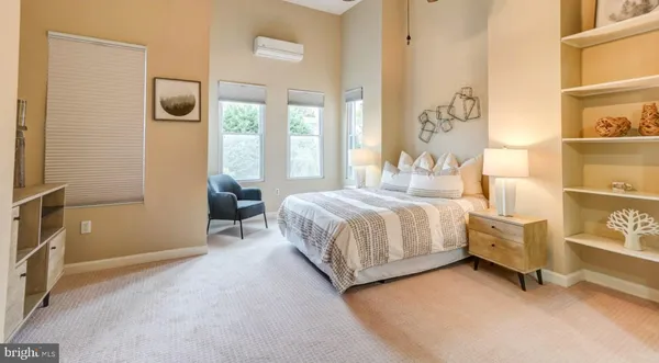 a bedroom with a bed and a cabinets