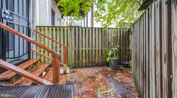 a view of balcony with wooden floor