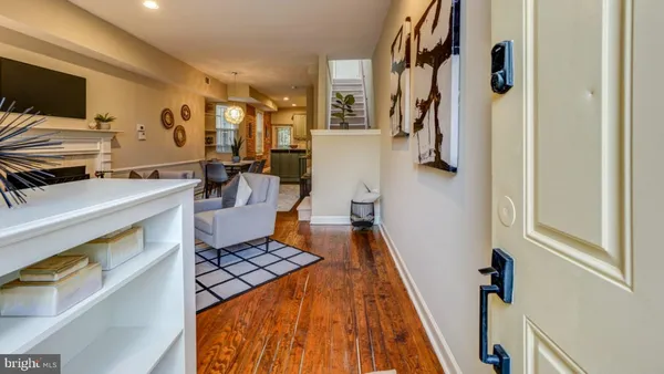 a living room with furniture and a rug