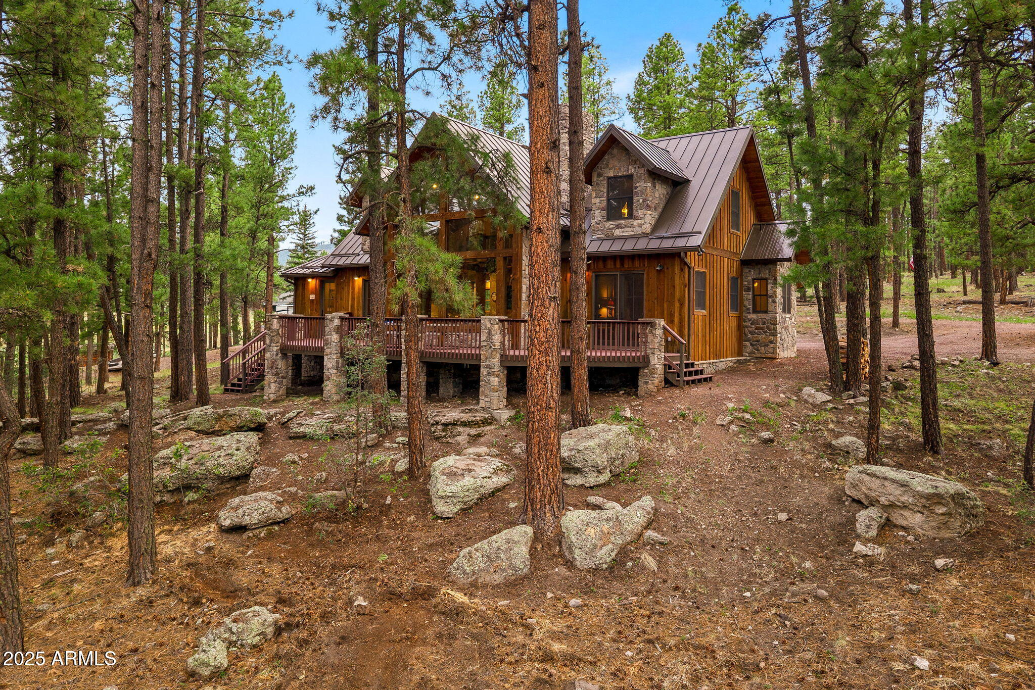 36 County Road N2147 Alpine, AZ 85920 - Photo 36 of 47 a view of a house with a yard covered in the forest