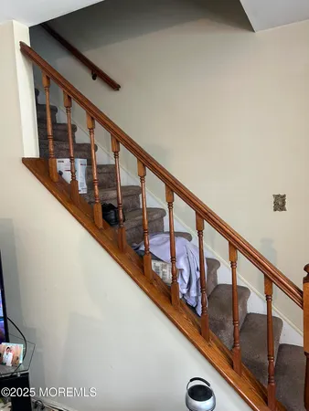 a view of staircase with lots of wooden floor