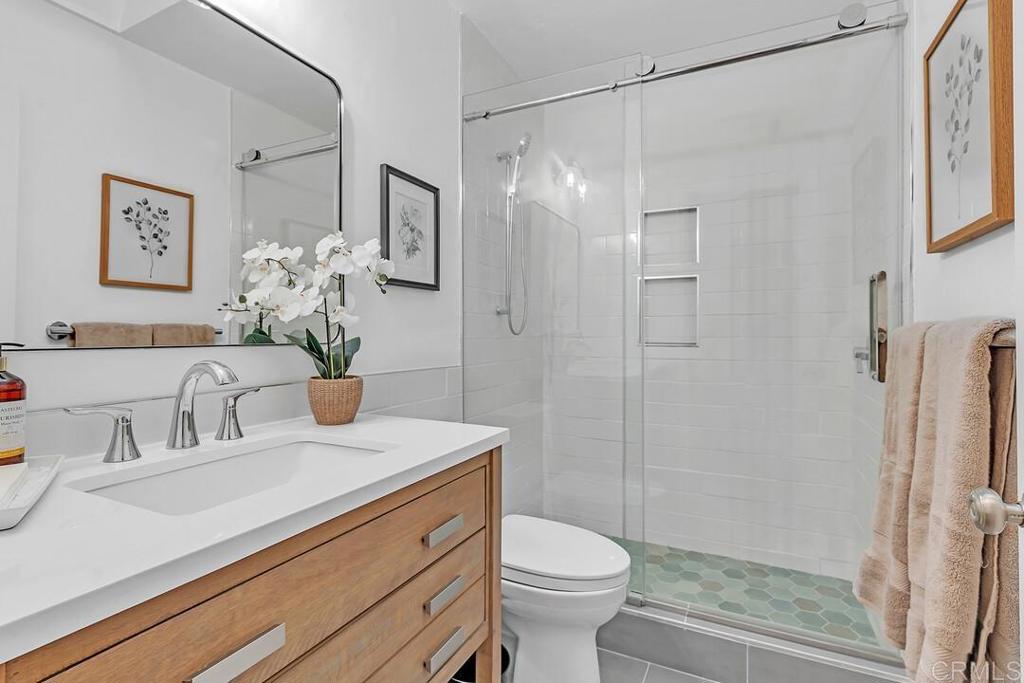 340 Trailview Road Encinitas, CA 92024 - Photo 18 of 35 a bathroom with a sink toilet and shower