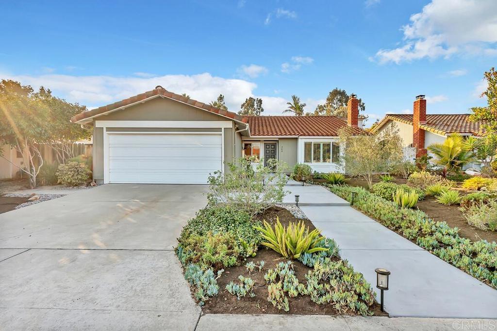 340 Trailview Road Encinitas, CA 92024 - Photo 2 of 35 a front view of a house with a yard and garage