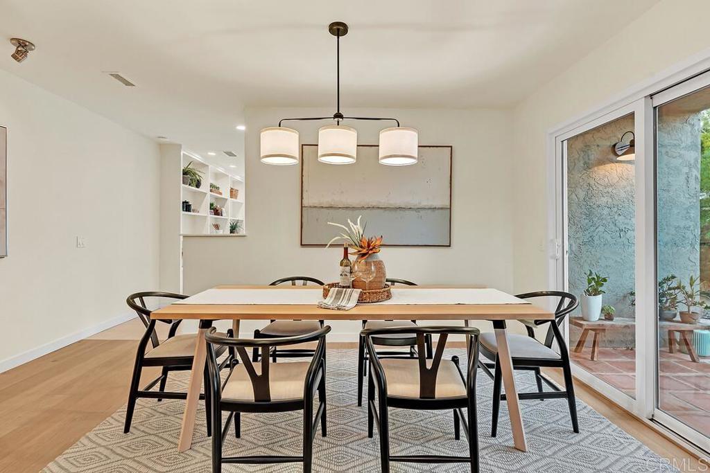 340 Trailview Road Encinitas, CA 92024 - Photo 10 of 35 a view of a dining room with furniture wooden floor and chandelier
