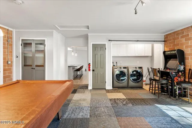 a bedroom with furniture and a gym equipment