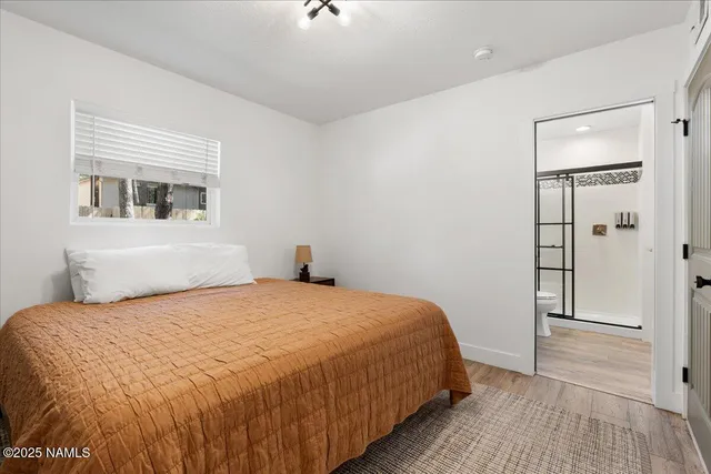 a bedroom with a bed and closet