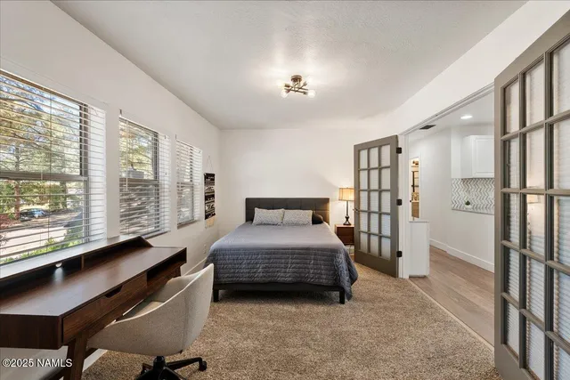 a bedroom with a bed window and a walk in closet