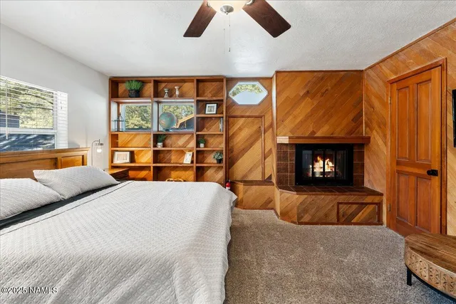 a bedroom with a bed and fireplace