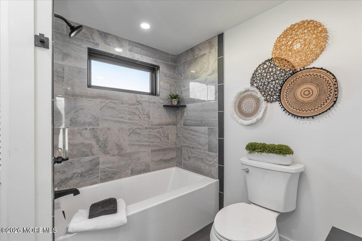 58 Locust Grove Hazlet, NJ 07730 - Photo 20 of 30 a bathroom with a sink a toilet and bathtub