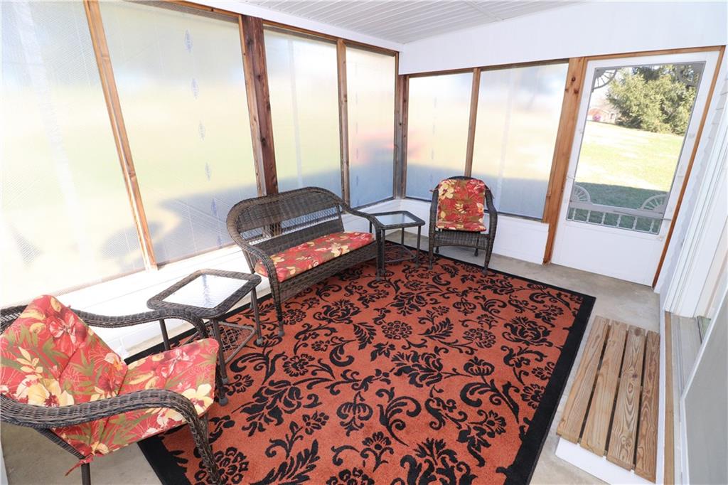 340 Dutch Road Harmony, PA 16037 - Photo 22 of 25 Getaway onto the 3 Seasons Room for a morning coffee or a weekend BBQ with Family & Friends. (Shown as winterized).