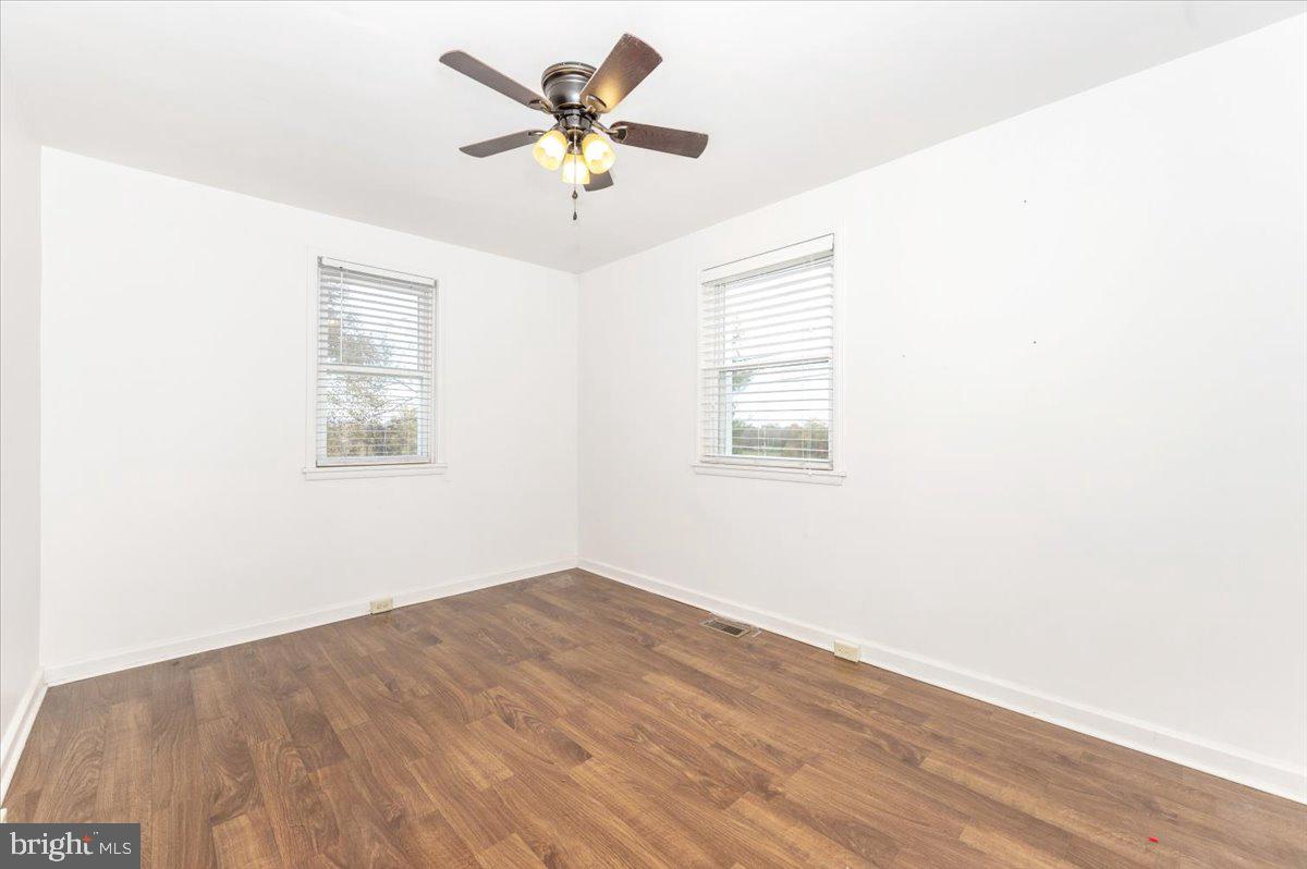 12514 Creagerstown Road Thurmont, MD 21788 - Photo 22 of 57 an empty room with a window and a ceiling fan