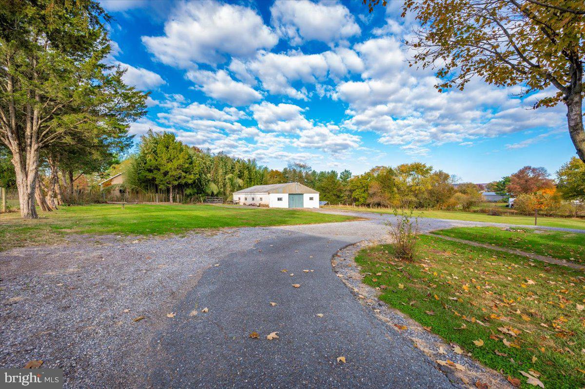 12514 Creagerstown Road Thurmont, MD 21788 - Photo 50 of 57 a view of a lake with houses in the background