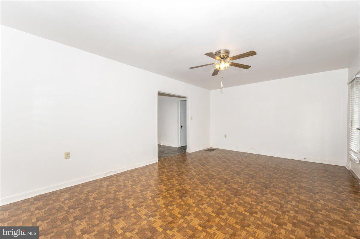 12514 Creagerstown Road Thurmont, MD 21788 - Photo 5 of 57 a view of a room with a ceiling fan and carpet