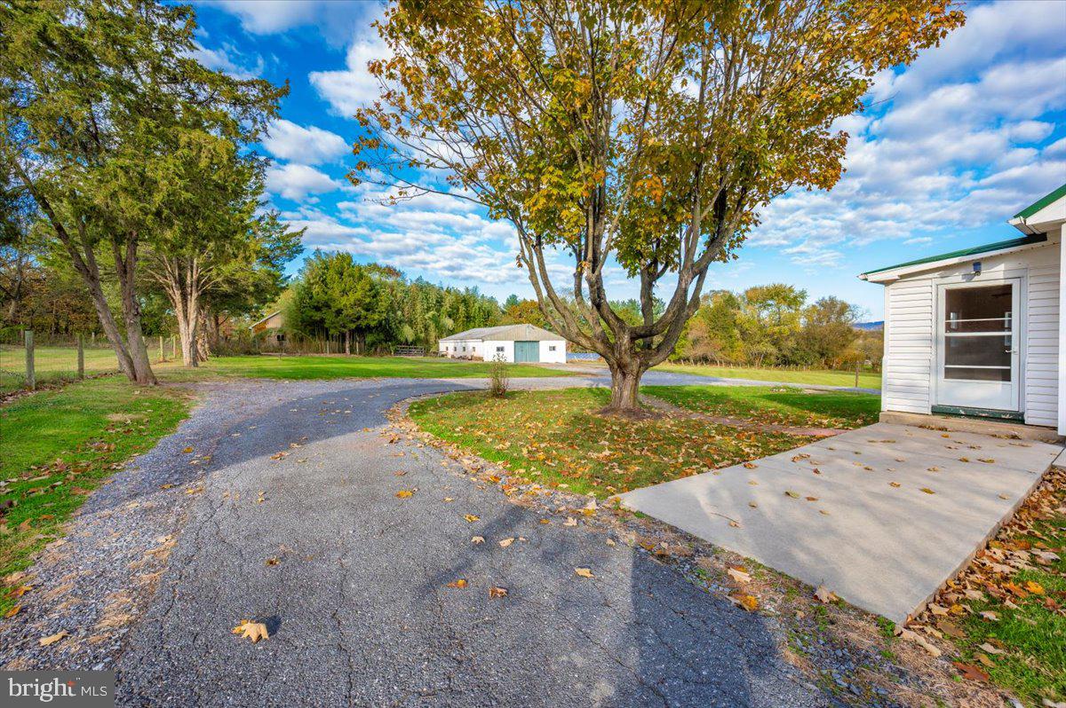 12514 Creagerstown Road Thurmont, MD 21788 - Photo 51 of 57 a view of a house with backyard and a tree