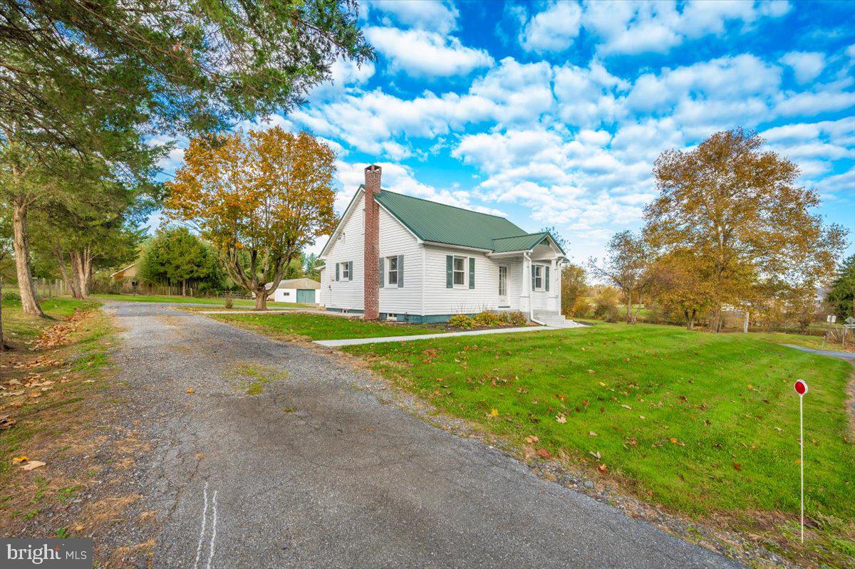 12514 Creagerstown Road Thurmont, MD 21788 - Photo 54 of 57 a view of a house with backyard and tree s
