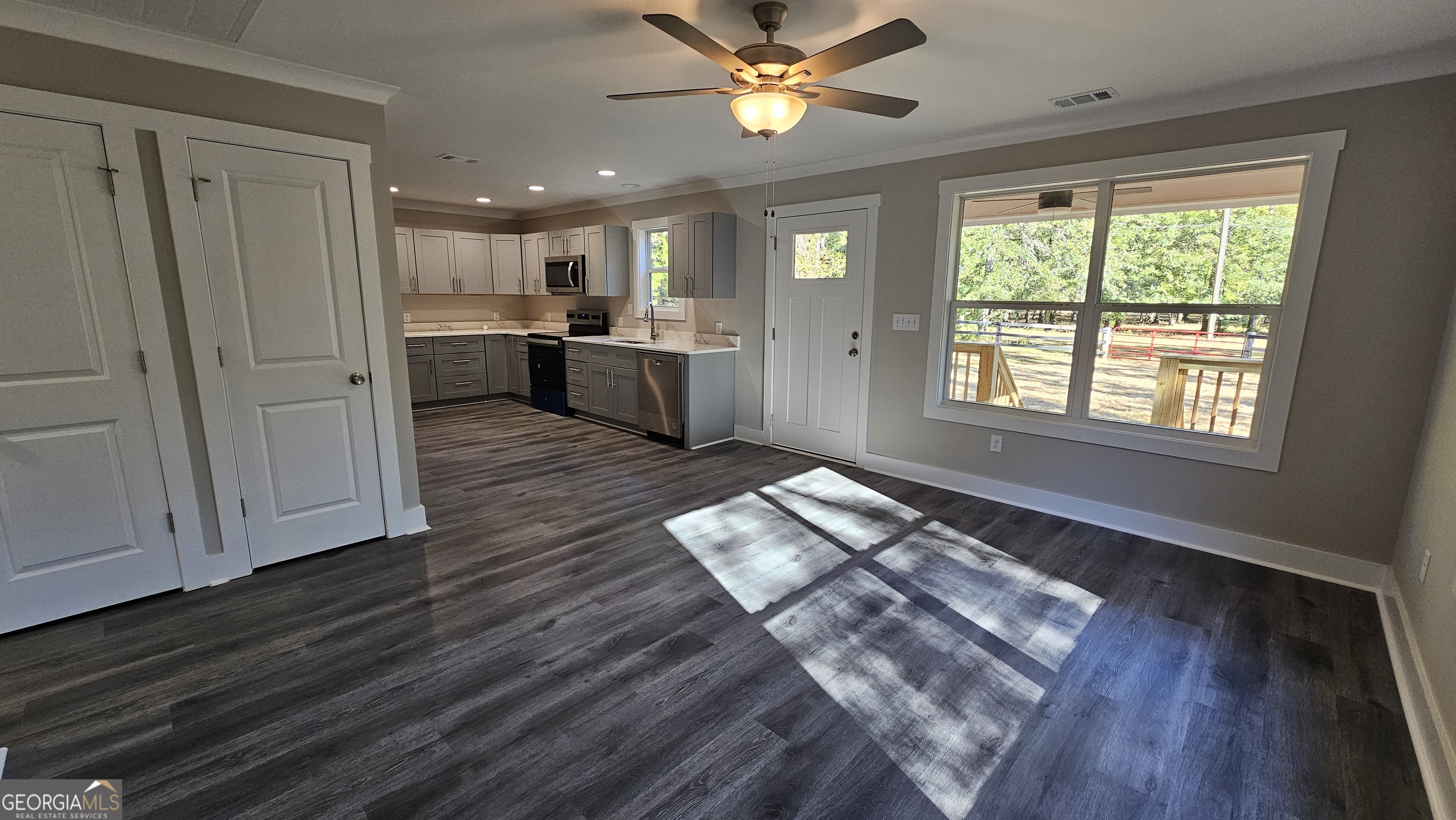 128 Sunset Drive Eatonton, GA 31024 - Photo 4 of 16 a view of a kitchen with wooden floor and a window