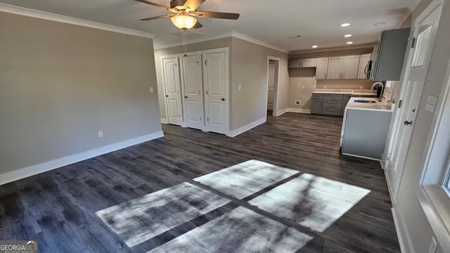 a view of kitchen with cabinets