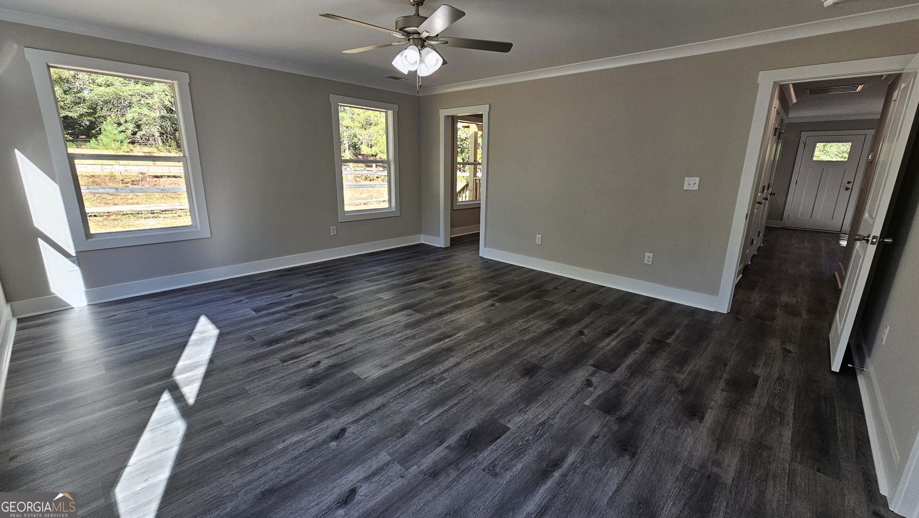 128 Sunset Drive Eatonton, GA 31024 - Photo 6 of 16 wooden floor in an empty room with a window