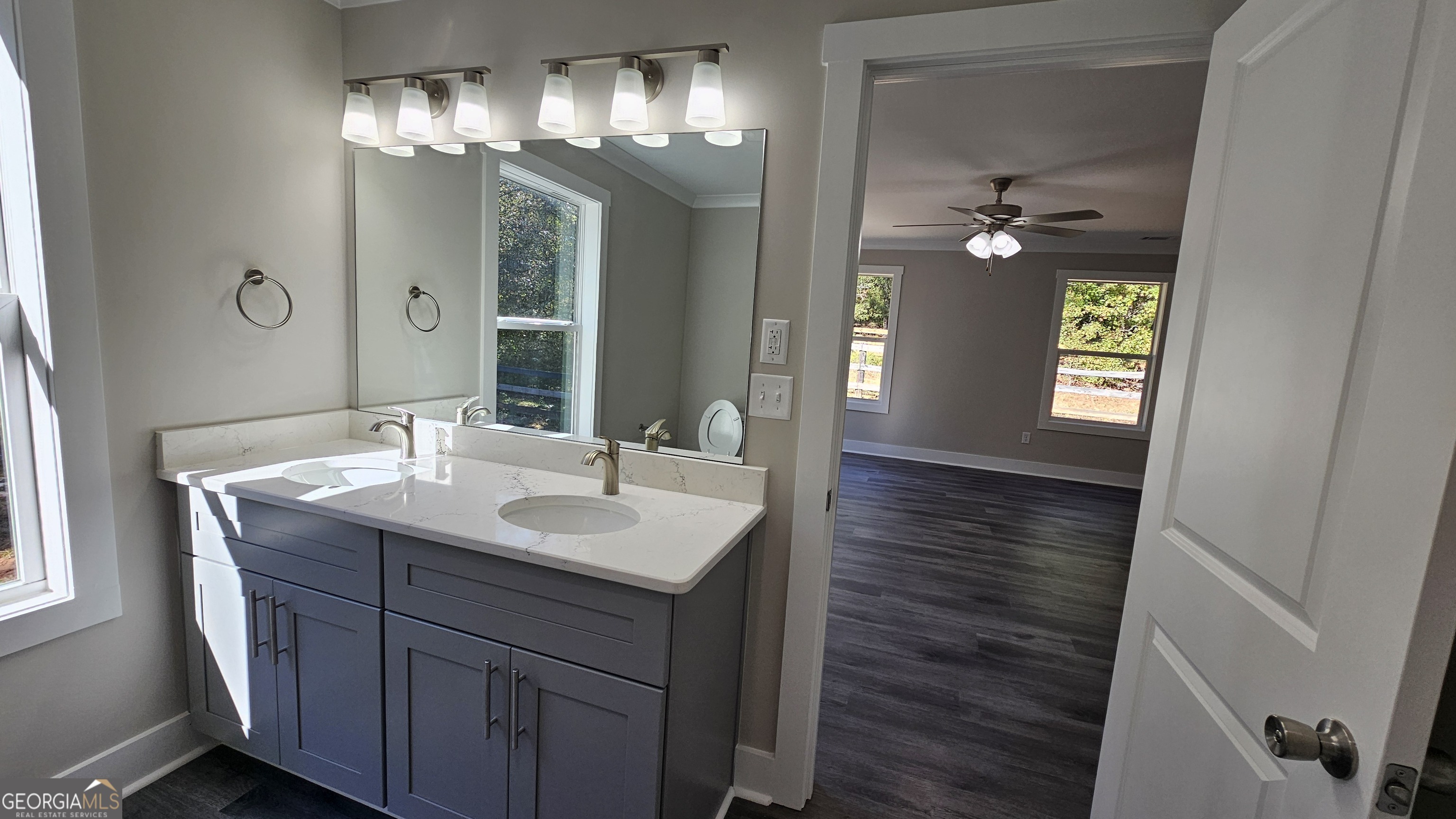 128 Sunset Drive Eatonton, GA 31024 - Photo 7 of 16 a bathroom with a sink and a mirror