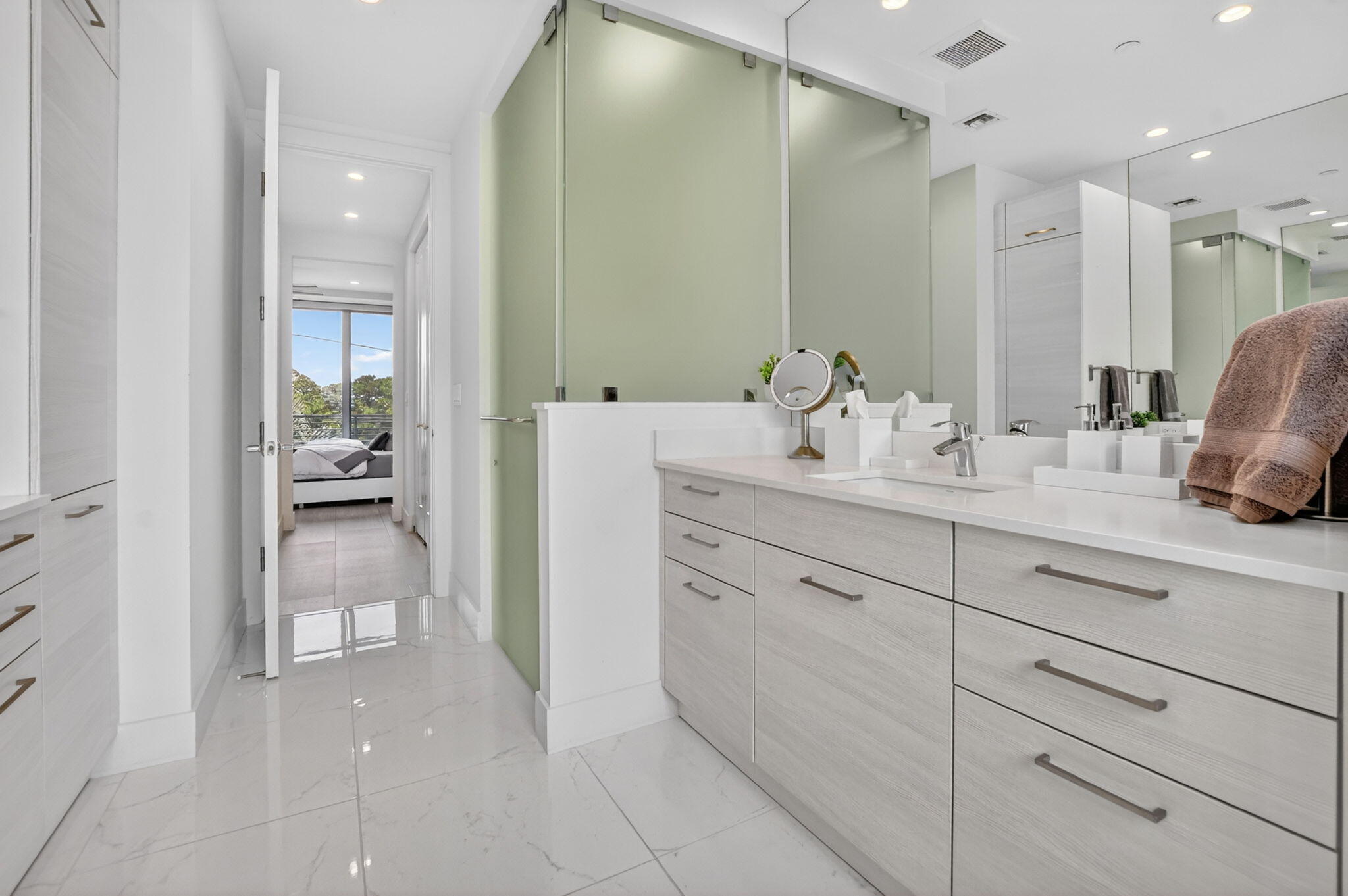 4021 Northwest 18th Way Boca Raton, FL 33431 - Photo 27 of 37 a bathroom with a sink vanity and a mirror