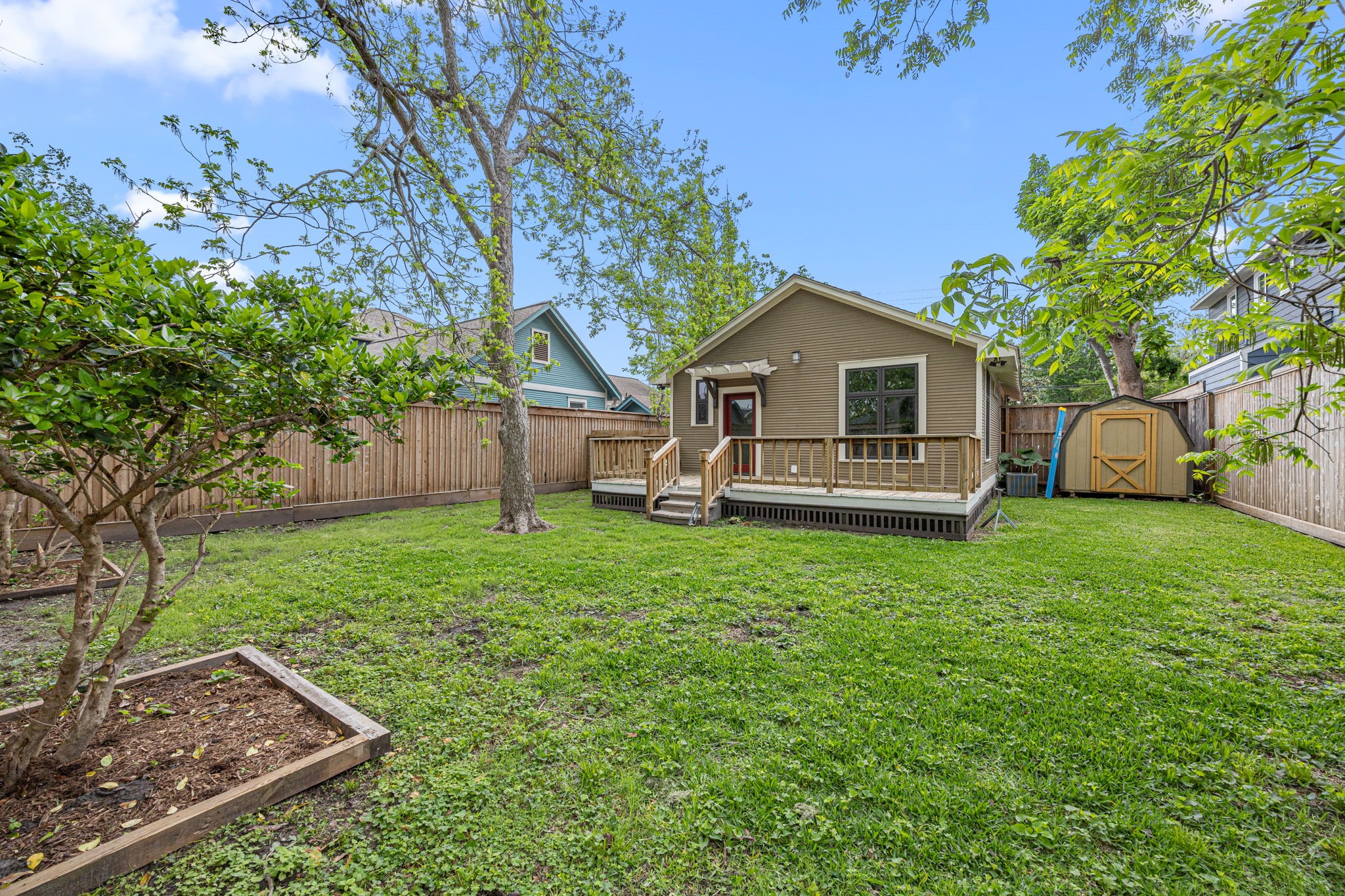 1115 Adele Street Houston, TX 77009 - Photo 17 of 19 Alternate backyard view showcasing generous yard size and peaceful setting.