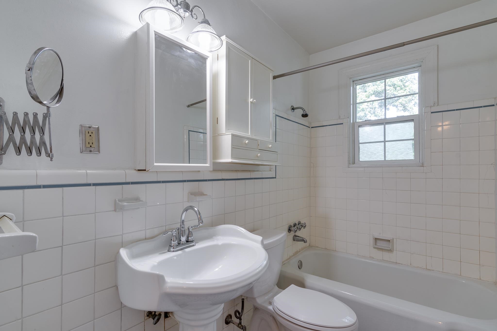 1885 Peabody Avenue, Unit 3 Memphis, TN 38104 - Photo 16 of 30 a bathroom with a sink toilet and a mirror