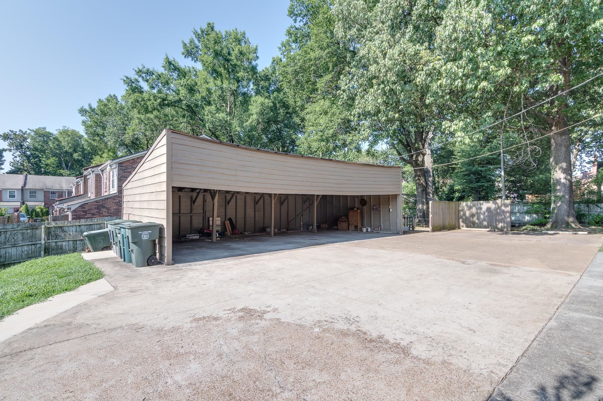 1885 Peabody Avenue, Unit 3 Memphis, TN 38104 - Photo 25 of 30 a view of a house with a yard and garage