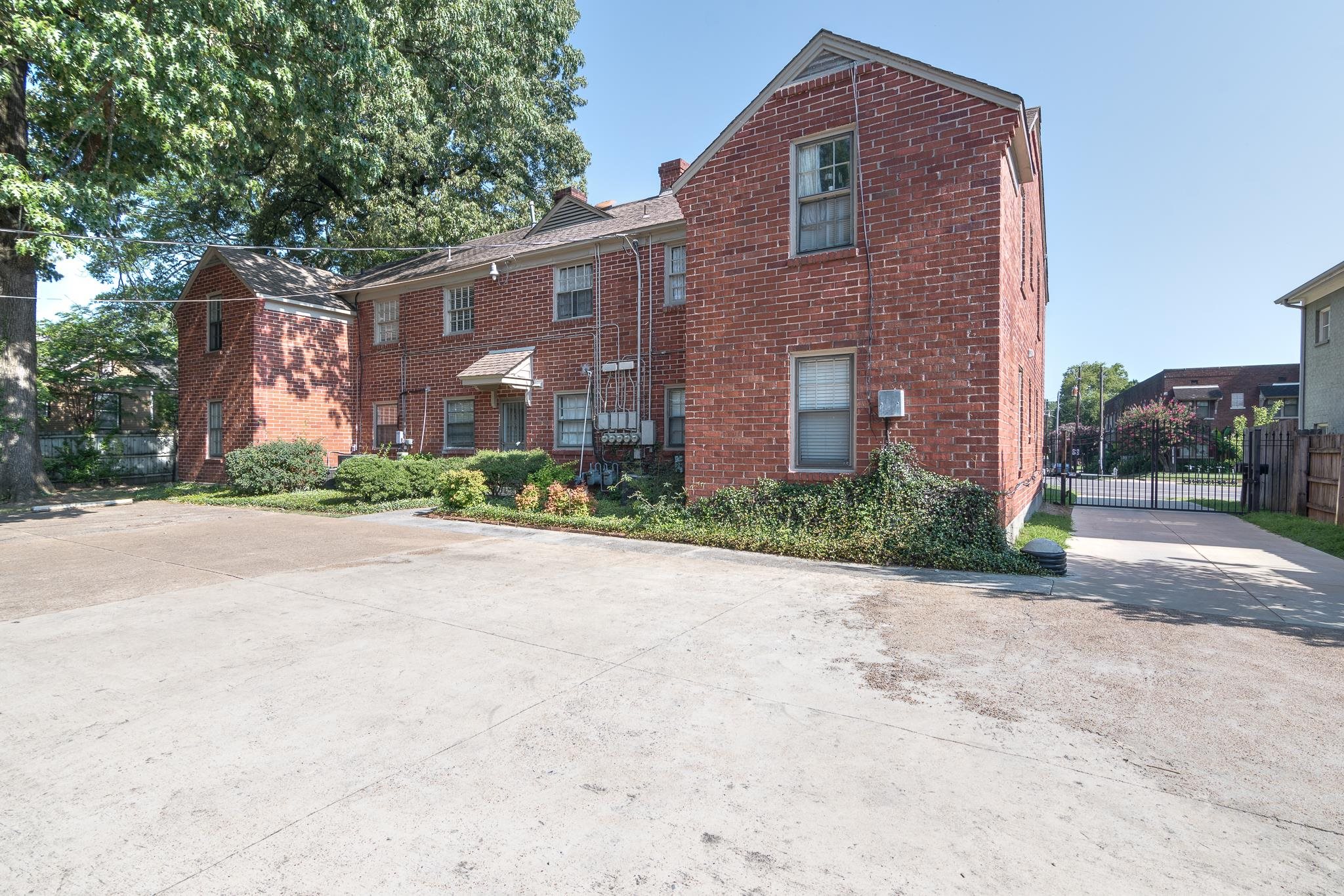 1885 Peabody Avenue, Unit 3 Memphis, TN 38104 - Photo 27 of 30 a front view of a house with a yard and garage