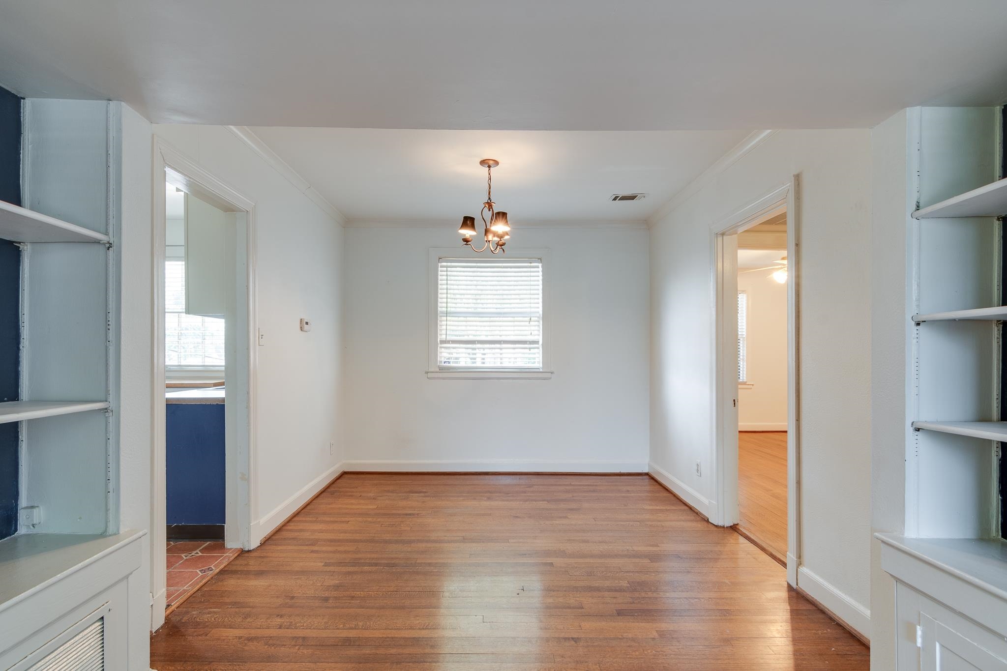 1885 Peabody Avenue, Unit 3 Memphis, TN 38104 - Photo 7 of 30 wooden floor in an empty room with a window