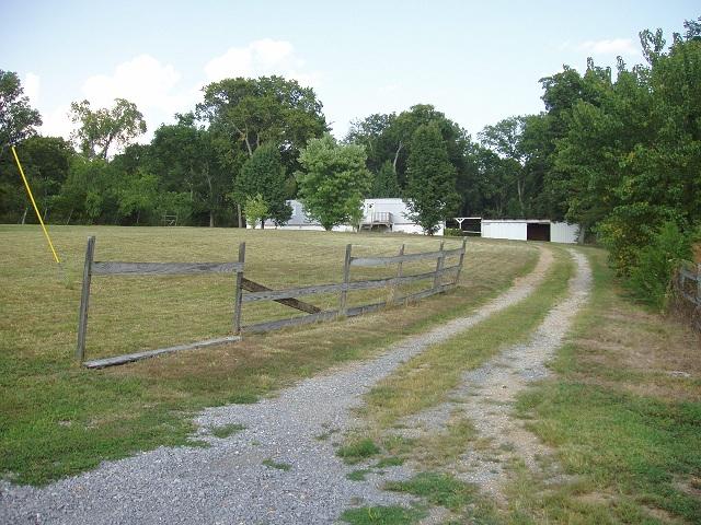 997 Hamilton Chambers Road Lebanon, TN 37087 - Photo 1 of 12 Lot's of land!! The fenced off part to the right of the driveway is all part of this 5.79 acres.