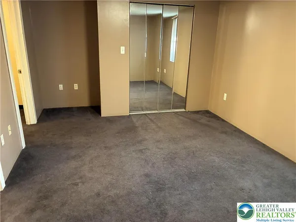 an empty room with closet