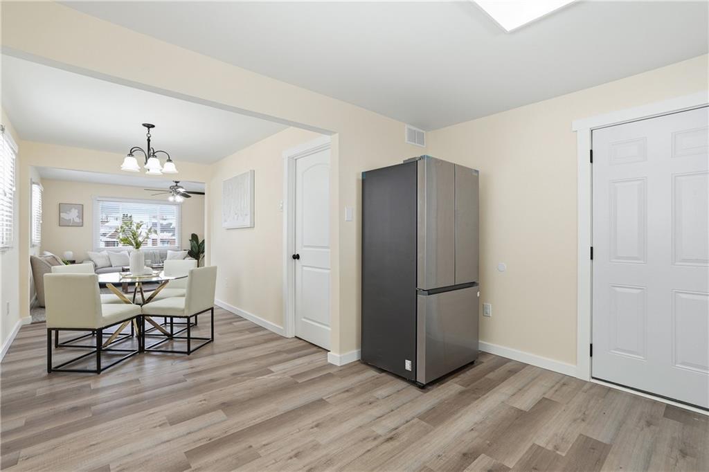 805 Colonial Avenue Monaca, PA 15061 - Photo 14 of 30 a view of a dining room with furniture and wooden floor
