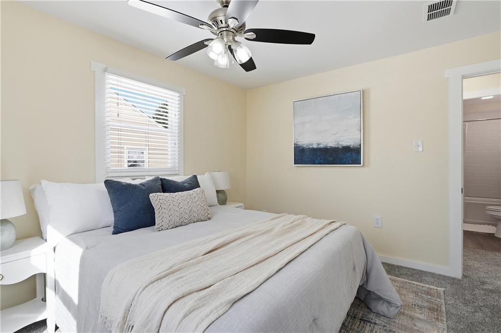 805 Colonial Avenue Monaca, PA 15061 - Photo 19 of 30 a bedroom with a large bed and a ceiling fan