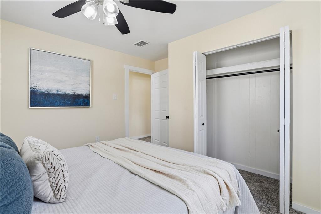 805 Colonial Avenue Monaca, PA 15061 - Photo 21 of 30 a bedroom with a large bed and a chandelier