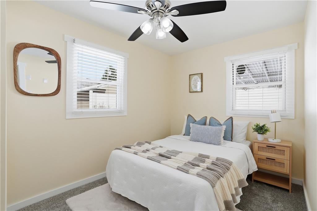 805 Colonial Avenue Monaca, PA 15061 - Photo 22 of 30 a bedroom with a bed and a chandelier