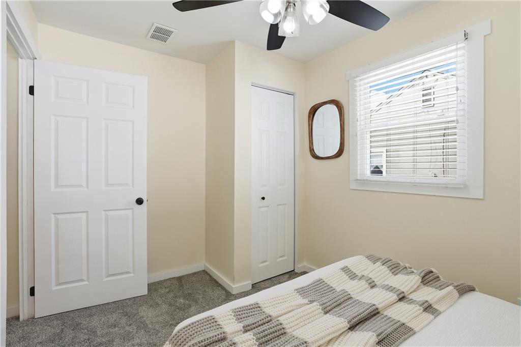 805 Colonial Avenue Monaca, PA 15061 - Photo 23 of 30 a bedroom with a large bed and a chandelier