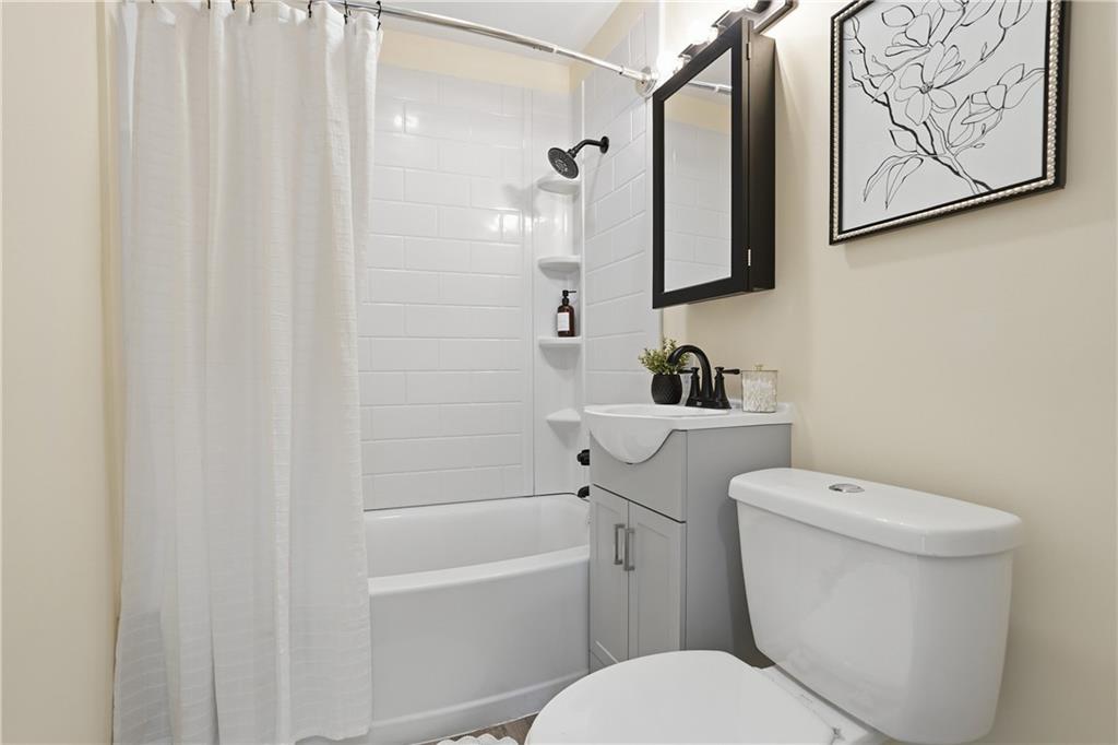 805 Colonial Avenue Monaca, PA 15061 - Photo 25 of 30 a white toilet sitting next to a bathroom sink