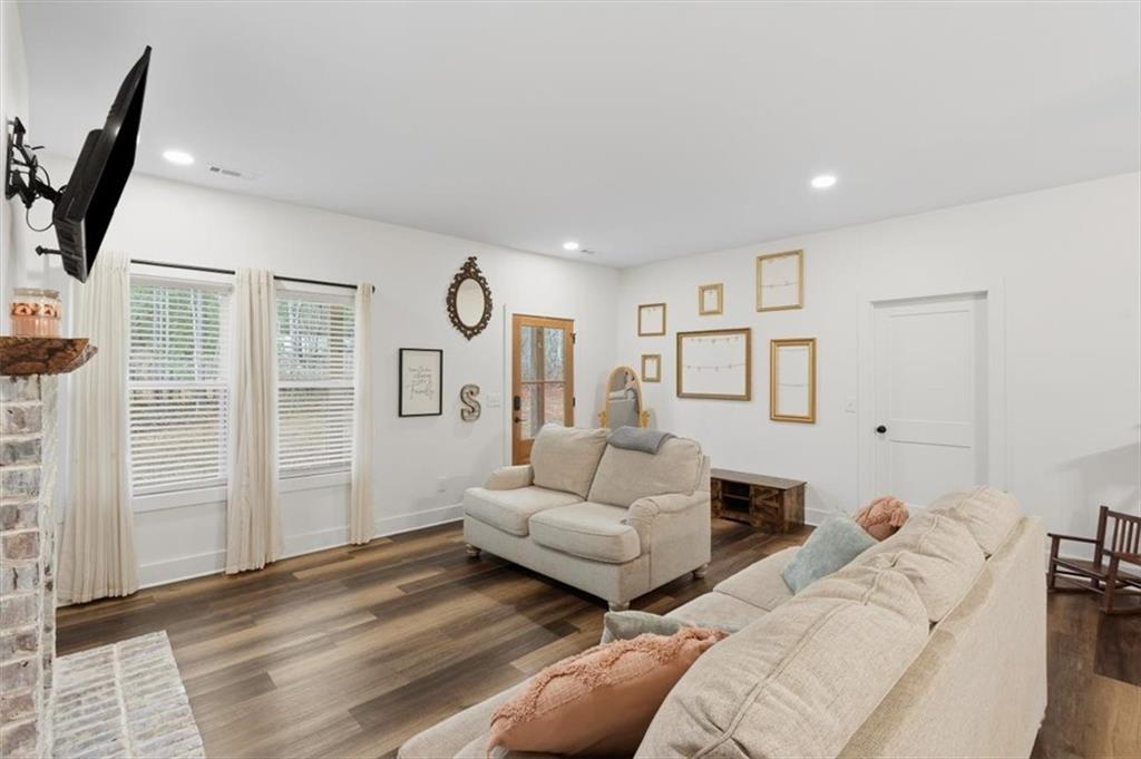 1475 Ben Davis Road Buchanan, GA 30113 - Photo 10 of 61 a living room with furniture and a flat screen tv