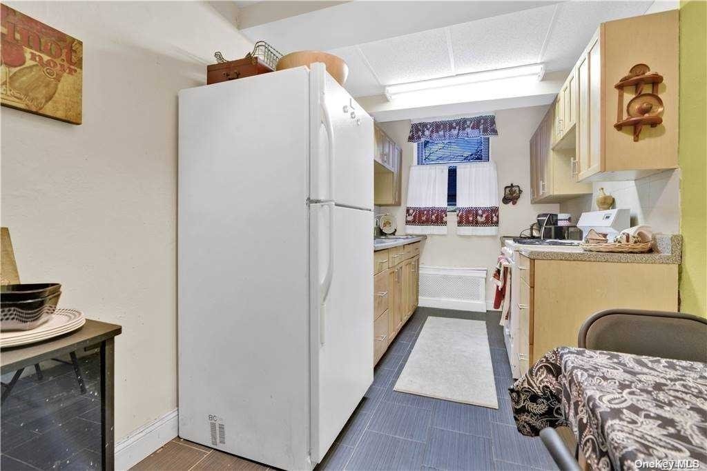 a kitchen with a refrigerator a sink and a stove