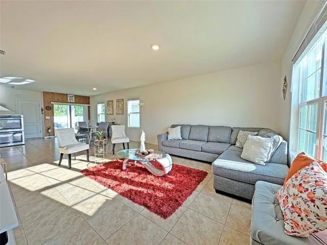 a living room with furniture and a window