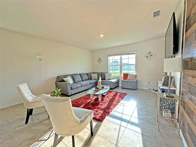 a living room with furniture and a window