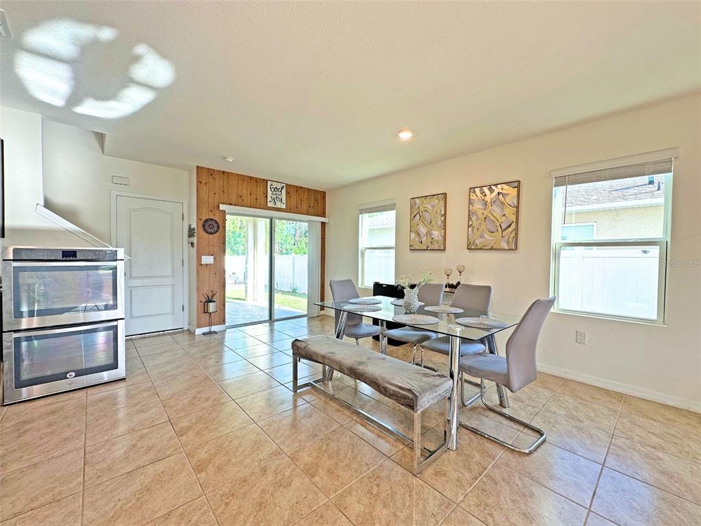 6988 Botanic Boulevard Harmony, FL 34773 - Photo 17 of 61 a living room with furniture and a window