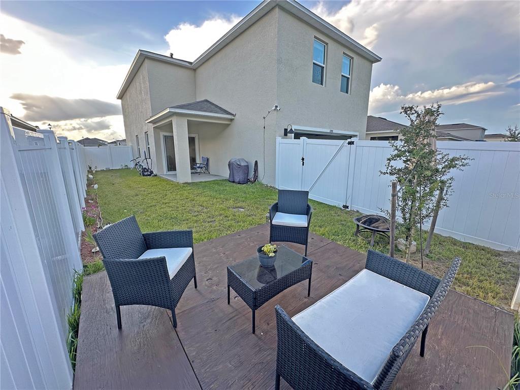 6988 Botanic Boulevard Harmony, FL 34773 - Photo 39 of 61 a view of a patio in backyard