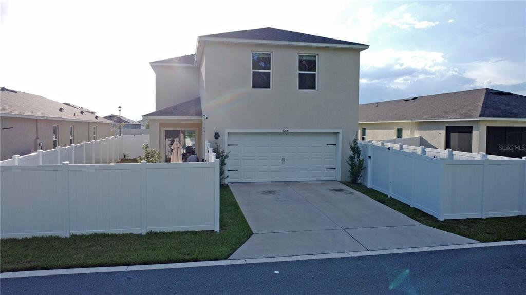 6988 Botanic Boulevard Harmony, FL 34773 - Photo 42 of 61 a view of a house with a backyard