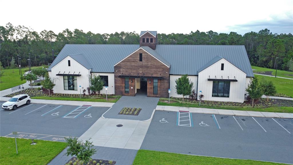 6988 Botanic Boulevard Harmony, FL 34773 - Photo 45 of 61 a front view of house with yard and green space
