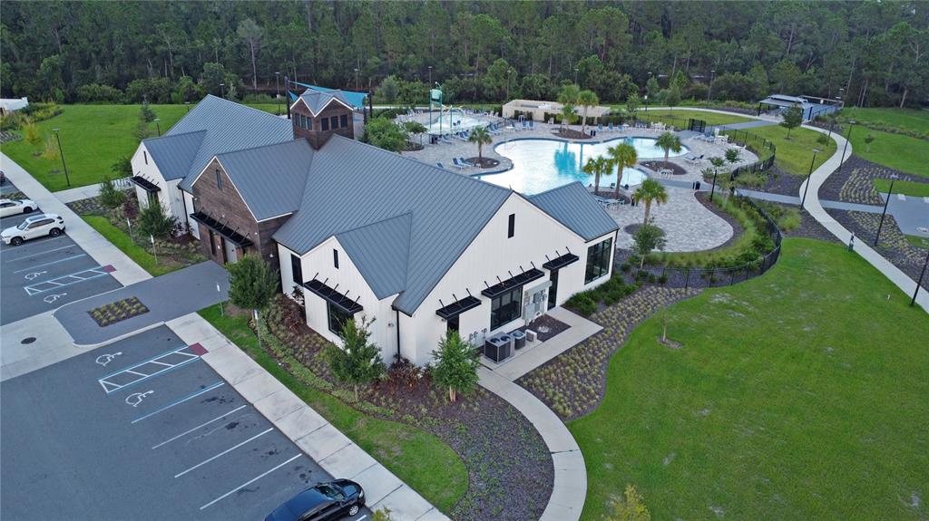 6988 Botanic Boulevard Harmony, FL 34773 - Photo 47 of 61 a aerial view of a house with garden space and patio